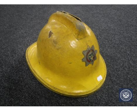 A vintage Cumbria Fire Service helmet