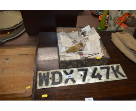 A vintage licence plate; together with a box of various post-cards ephemera etc.