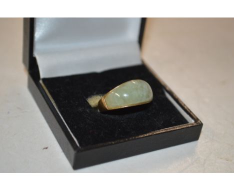 A 9ct gold and jade coloured mounted ring 