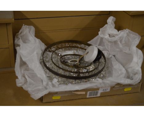 A light fitting hung with glass drops 
