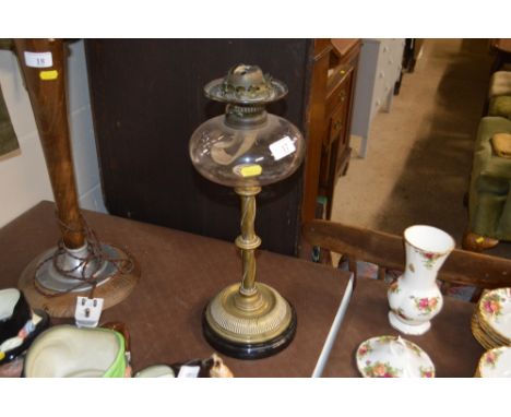 A brass and glass oil lamp