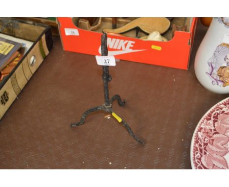 A wrought iron rush light 