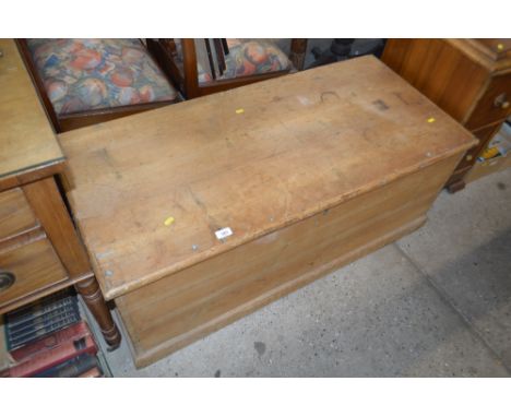 A stripped pine blanket box and contents of a rug, lamp shades etc.