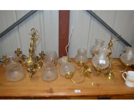 Two brass and glass light fittings and matching wall lights 