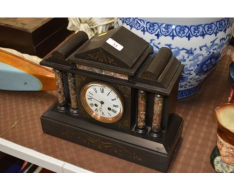 A black slate mantel clock