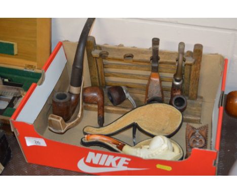A box of various pipes to include a Claude decorated pipe with case; silver collared pipe etc.