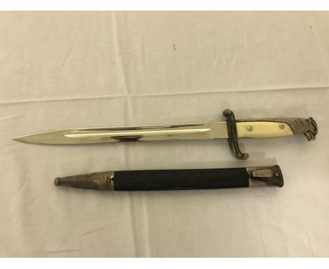 WWII German Dress Dagger and sheath with Eagle handle and ivory type handle, blade marked WKC.