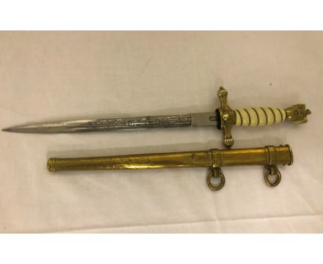 WWII German Kriegsmarine dagger and sheath, blade marked E & F Horster Solingen. CONDITION REPORT: Minor Split to the handle 