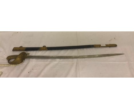 A 19th/20th century  Naval sword and sheath with Pipe Backed Blade.