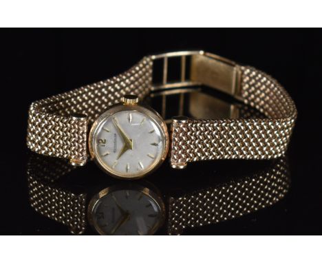 Jaeger LeCoultre 9ct gold ladies wristwatch with gold hands and hour markers, silver dial and signed movement, on 9ct gold br