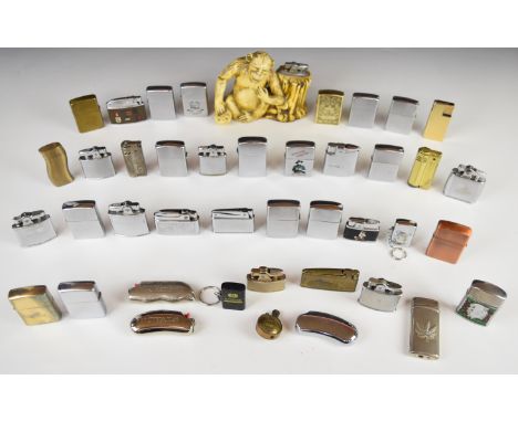 Prince table lighter in the form of monkey / chimpanzee resting against tree stump and a collection of forty pocket cigarette