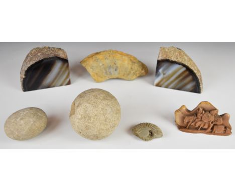 A pair of polished agate geode bookends, ammonite fossil and circular stone ball / boulle with two depressions for finger gri