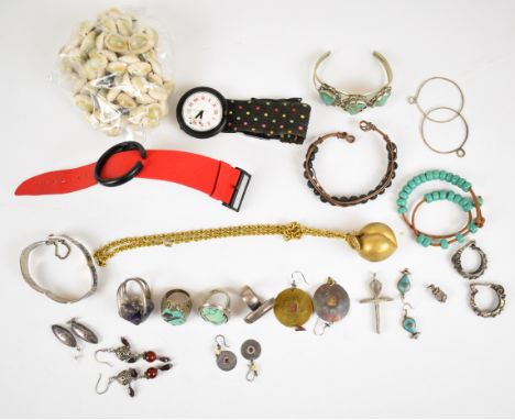 A collection of jewellery including gilt pendant in the form of a peach by Zev, cowrie shell necklace, silver rings set with 