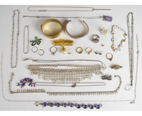 A collection of jewellery including 9ct gold earrings set with a sapphire, yellow metal ring, tru diamonds ring, silver shell
