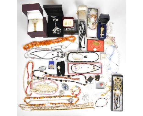 A collection of costume jewellery including beaded and crystal necklaces, Whitby jet and mother of pearl brooch, other vintag