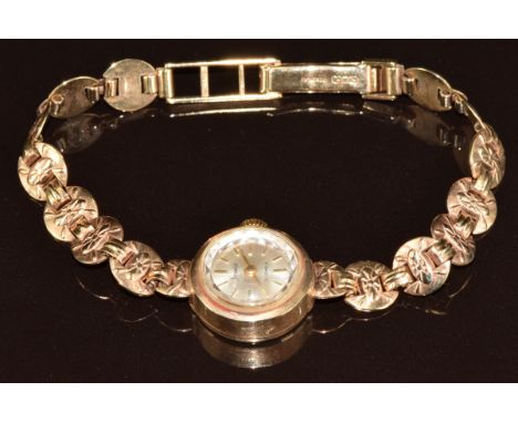 Accurist 9ct gold ladies wristwatch with gold hands and hour markers, silver dial and signed 21 jewel movement, on 9ct gold b