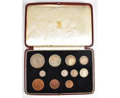 Cased part set of 1935 George V specimen coins, including rocking horse crown