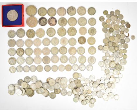 Approximately 1395g pre-1947 British silver coinage to include a boxed 1935 George V rocking horse crown, further rocking hor