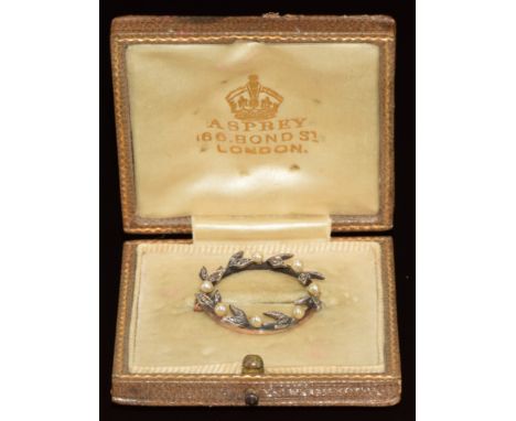 A 9ct gold brooch set with rose cut diamonds and pearls in a wreath design, in original Asprey London box, 3.2g, 2.4cm