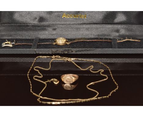A 9ct gold signet ring, two 9ct gold chains, 9ct gold charm in the form of a heart and cross (8.4g) and a 9ct gold cased Accu