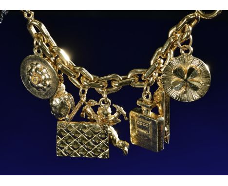 Chanel 'Iconic' charm bracelet with turtle, perfume bottle, angel, quilted purse, high heeled shoe, flower and clover charms,