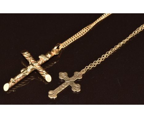 A 9ct gold crucifix and 9ct gold cross both on 9ct gold chains, 5.7g, one 51cm, one damaged with no clasp