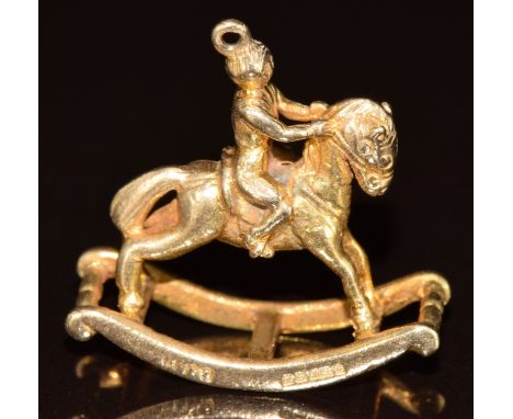 A 9ct gold charm in the form of a rocking horse, 5.3g, 2.2cm