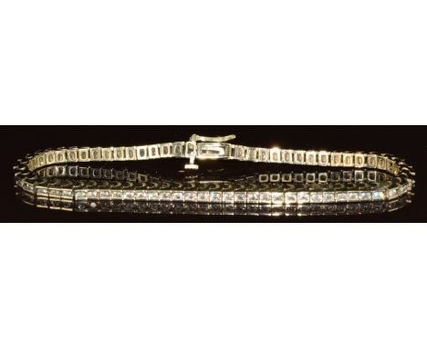 A 14ct gold tennis bracelet set with seventy round cut diamonds, the total diamond weight approximately 1ct, 14.3g, 18.5cm