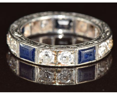 Art Deco platinum eternity ring set with old cut diamonds and rectangular sapphires with engraved decoration to the inner and