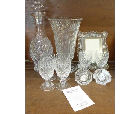 A Waterford crystal vase, decanter and six glasses, two clocks and a photograph frame 