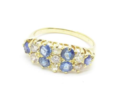 A yellow metal set sapphire and diamond cluster ring, 2.8g, M 