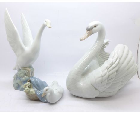 Two Lladro figures; large swan and duck with ducklings and a Nao figure of a swan 