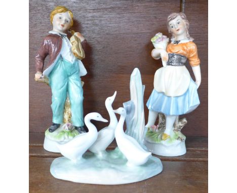 A pair of continental figures and a Nao figure of geese 