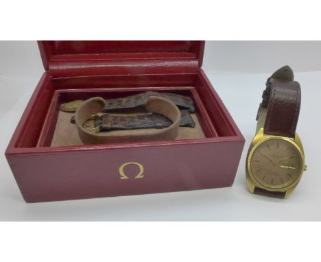 An 18ct gold cased Omega Constellation automatic chronometer wristwatch with day/date and original receipt, boxed 