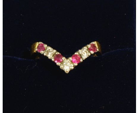 An 18 carat gold ruby and diamond wishbone ring, size K 
