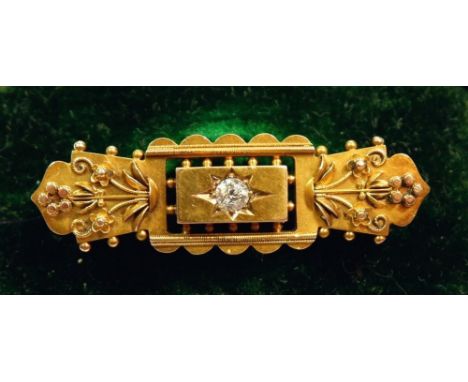 A Victorian 15 carat gold brooch with applied decoration and set diamond, 4.2cm long, cased, 4g 