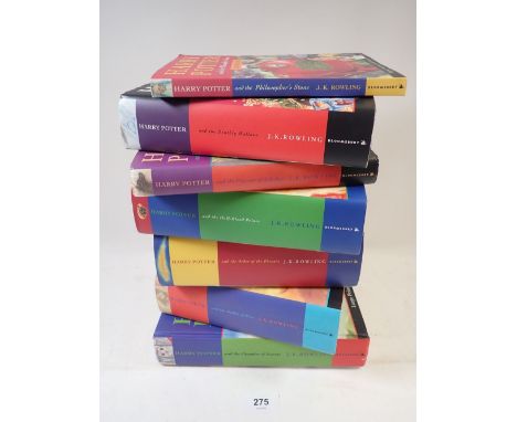 A collection of six Harry Potter hardback books and one paperback 