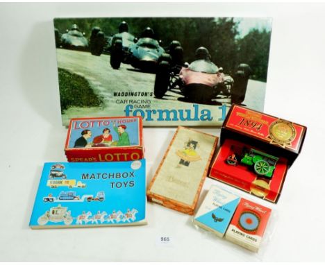 A box of various vintage toys and games including 'Waddingtons Car Racing Game Formula I', Bridge, a 1894 Aveling-Porter stea