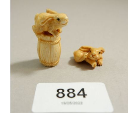 A Japanese Meiji period ivory netsuke of a rabbit on a barrel, 3.5cm tall, signed and a miniature carved rabbit 