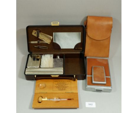 A Polaroid camera, a wine thermometer and a toiletry set, boxed 
