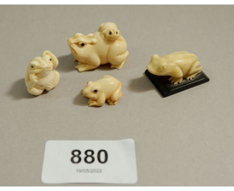 Two Japanese Meiji period ivory netsuke of frogs and two miniature carved frogs - the netsuke signed, largest 3cm wide 