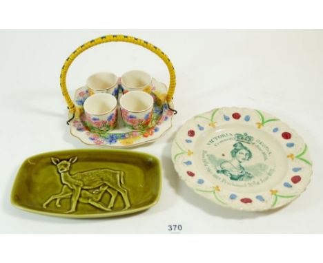 A Royal Stafford egg cup stand, a Poole green pin dish and a Queen Victoria commemorative plate, 1838