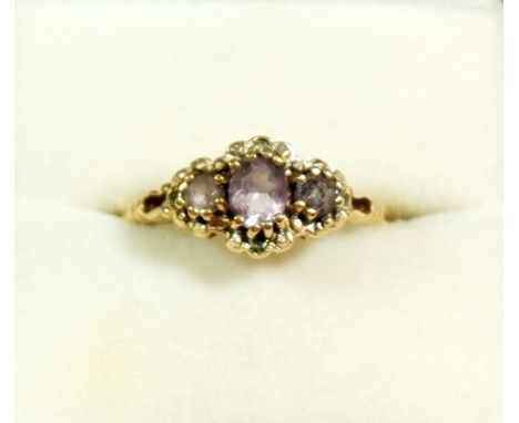 A 9 carat gold ring set three amethysts size O to P 