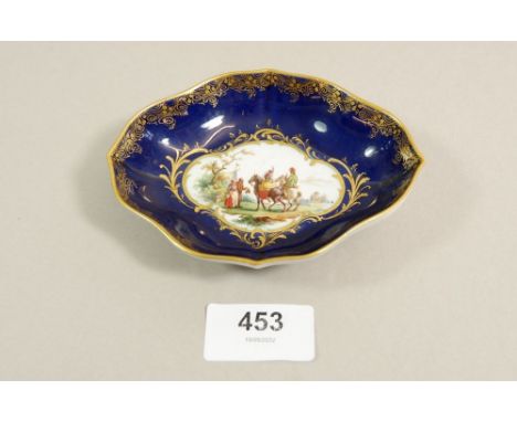 A 19th century Meissen ceramic pin dish with painted huntsman and hawk 