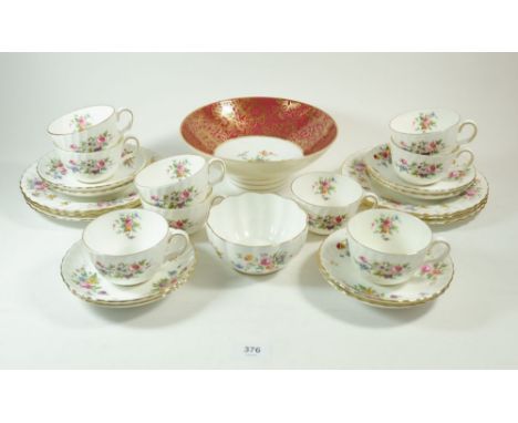 A Minton Marlow tea service comprising: nine cups and eight saucers, sugar bowl, six tea plates and a Minton fruit bowl 