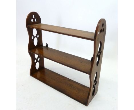 A set of light oak wall shelves 