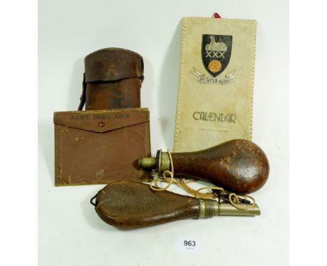 Two leather powder horns, a leather flask case, an 'Army Form' A2026 wallet and a 'Velum' Egypt regimental calendar holder 