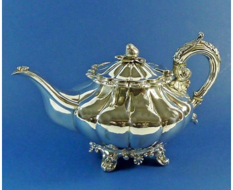 An Irish silver teapot of melon form with fruit finial, Dublin 1839 by Robert Smith 865g 