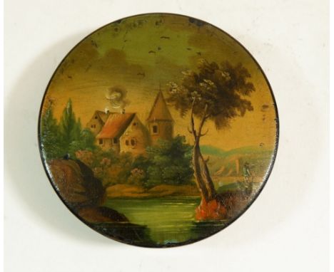 A 19th century papier mache circular snuff box painted chateau and river scene 