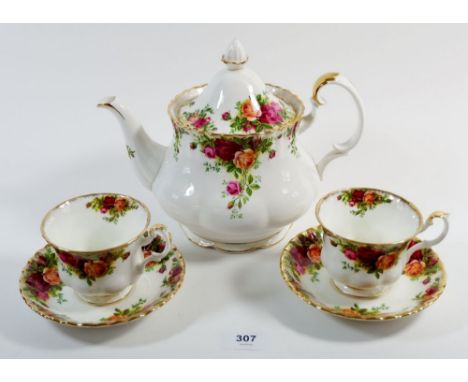 A Royal Albert 'Country Roses' tea service comprising: teapot, six cups and saucers, six tea plates and a cake plate 